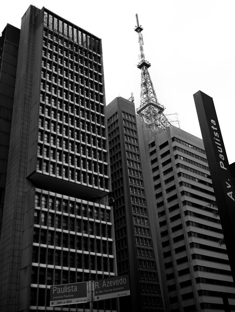 Black and white photo featuring the modern skyscrapers of Paulista Avenue in São Paulo with a communication tower.